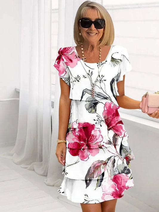 Mid-length pleated dress with ruffles and floral print for women